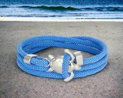 Sea Turtle Rope Bracelet with Silver/Black Charm Treat your wrist to a trendy nautical charm with the sea Turtle Rope Bracelet. This handcrafted accessory brings coastal vibes to any outfit. Key features/benefits: Adjustable rope bracelet with a polished