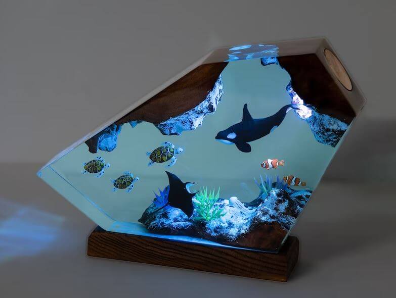 seaweSea Turtle Resin Lamp with OrcaBask in the tranquil glow of the sea with the Sea Turtle Resin Lamp with Orca. This handcrafted lamp brings the magic of the ocean right into your home with its charming sea turtle and orca design sculpted in fine resin