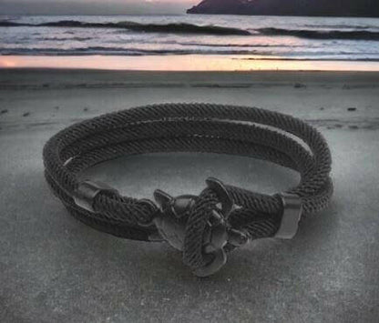 Sea Turtle Rope Bracelet with Silver/Black Charm Treat your wrist to a trendy nautical charm with the sea Turtle Rope Bracelet. This handcrafted accessory brings coastal vibes to any outfit. Key features/benefits: Adjustable rope bracelet with a polished