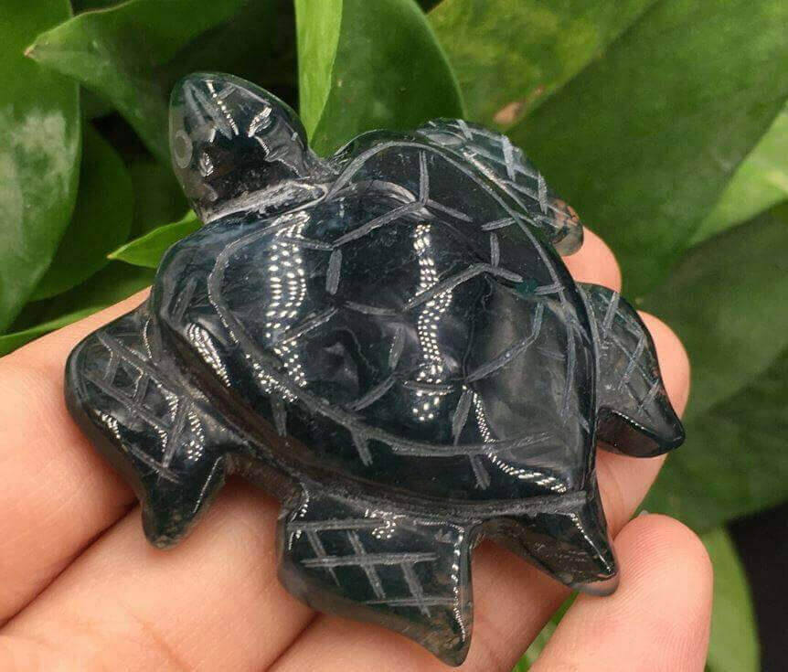 Natural Sea Turtle Quartz: Exquisite Sculpture Bring the magic of the sea into your home with this exquisite sea turtle sculpture carved from natural quartz crystal and silver obsidian. Hand-carved from natural stones for a one-of-a-kind work of art Stunn