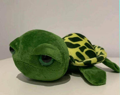 Sea Turtle Plushie Soft Toy in Green Bring the magic of the sea home with our lovable Sea Turtle Plushie! Handmade with care using eco-friendly, sustainable materials Vibrant colors and intricate details capture the beauty of real sea turtles Ultra-soft a