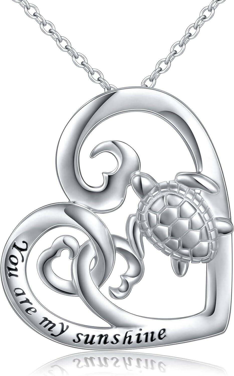 Sterling Silver Love Sea Turtle Necklace Capture the warmth of love with this Sterling Silver Love Sea Turtle Necklace. This stunning necklace features a polished sea turtle pendant facing towards the engraved "You Are My Sunshine" script to symbolize the