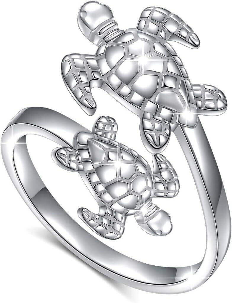 Double Sea Turtle Sterling Silver Ring Dive into luxury with the Sterling Silver Double Sea Turtle Ring. Handcrafted from 925 hypoallergenic sterling silver for timeless beauty Platinum plating ensures lasting shine without irritation Two sea turtles desi