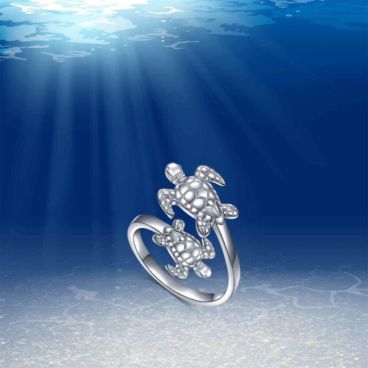 Double Sea Turtle Sterling Silver Ring Dive into luxury with the Sterling Silver Double Sea Turtle Ring. Handcrafted from 925 hypoallergenic sterling silver for timeless beauty Platinum plating ensures lasting shine without irritation Two sea turtles desi