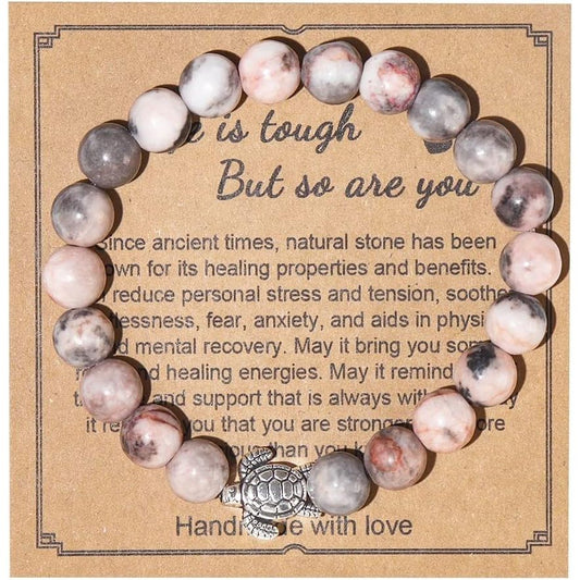 Handmade Gemstone Sea Turtle Bracelet Make a statement with this artisanal Natural Stones Beaded Bracelet featuring a stunning sea turtle charm - it's the perfect way to showcase your free spirit. Key features/benefits: Handmade braided rope bracelet with